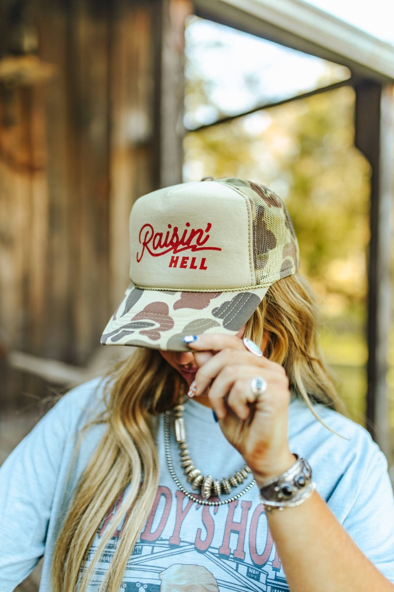 Raisin' Hell Green Camo Trucker Hat